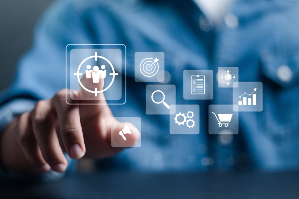 A person is touching an icon of human figures representing articles on Usenet.