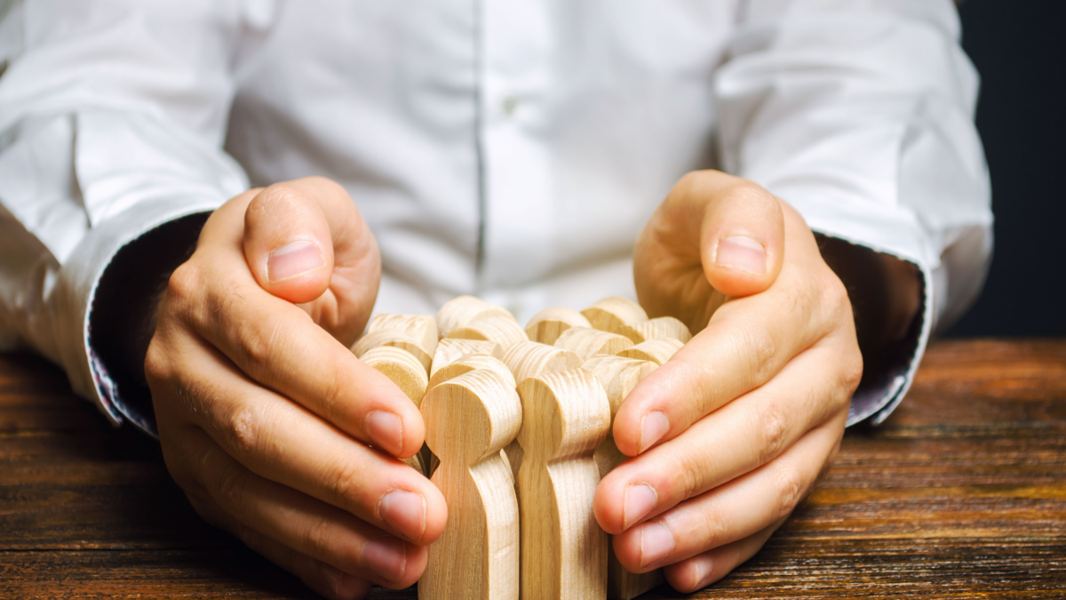 A person collecting a bunch of human-shaped wooden figures, representing Usenet article retention.