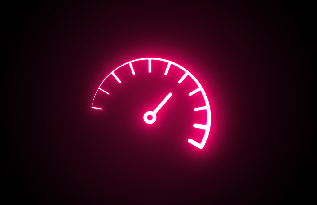 A glowing, neon red speedometer on a black background.